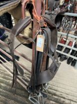 Four 4" stirrup leathers and irons and an anti cast roller