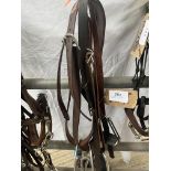 Two sets of stirrup leathers and stirrups