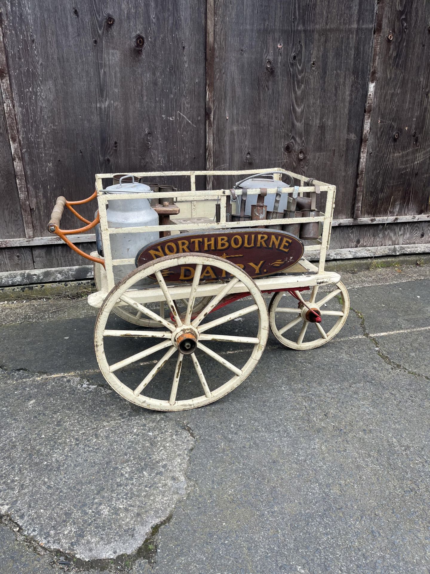DAIRY HAND CART This charming milk float features a tricycle-style metal undercarriage.