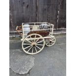 DAIRY HAND CART This charming milk float features a tricycle-style metal undercarriage.