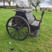 BREAKING CART requiring attention, in black, designed to suit a single horse.