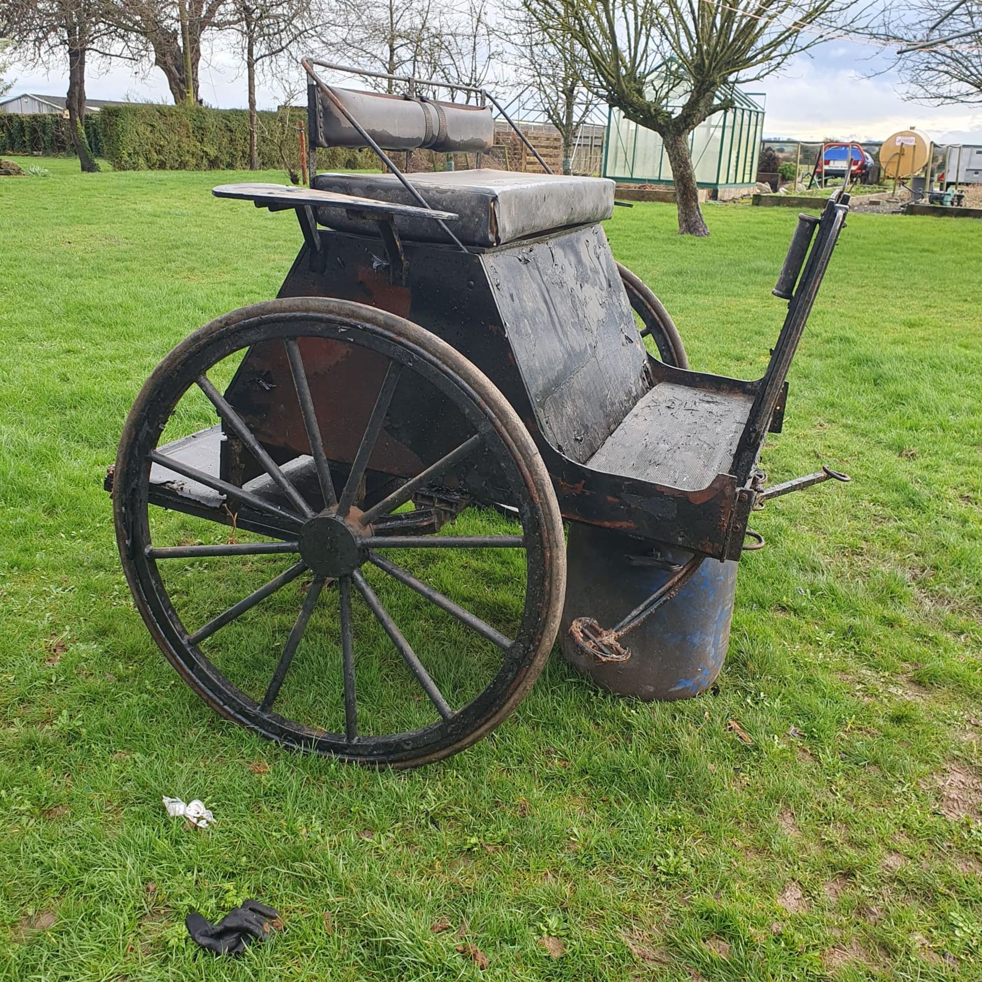 BREAKING CART requiring attention, in black, designed to suit a single horse.