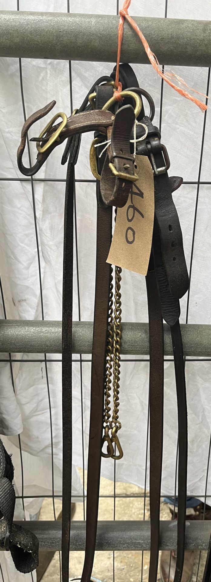 Two leather lead reins with brass chains, together with 2 leather and brass lead rein attachments