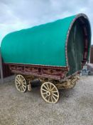 OPEN LOT WAGON painted maroon with cream undercarriage on iron tyred wheels.