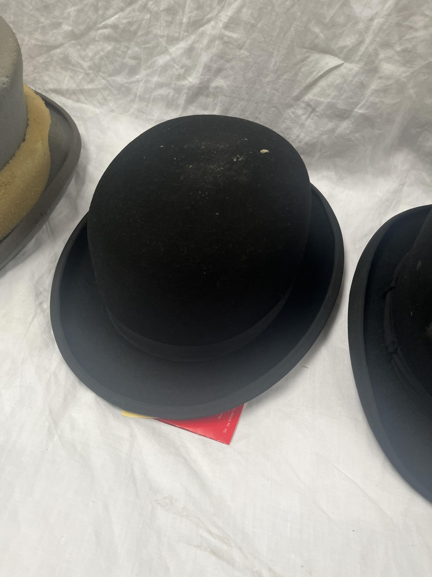 Black hard bowler hat by Christys size 6 7/8, new in box; another size 7 1/4; and a grey top hat - Image 3 of 4