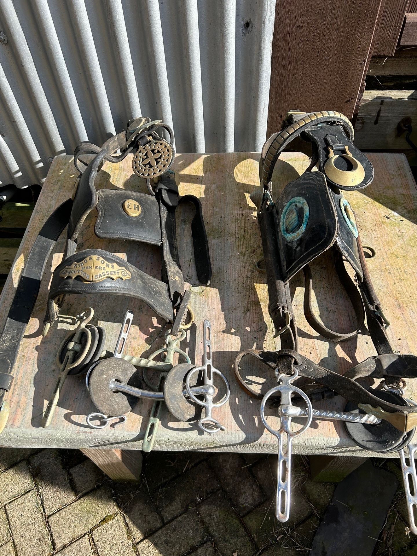 Two heavy horse leather bridles with bits