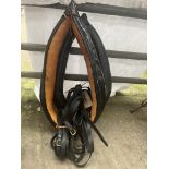 Two black leather collars measuring 18" and 21" and a pair set of reins
