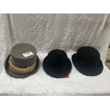 Black hard bowler hat by Christys size 6 7/8, new in box; another size 7 1/4; and a grey top hat