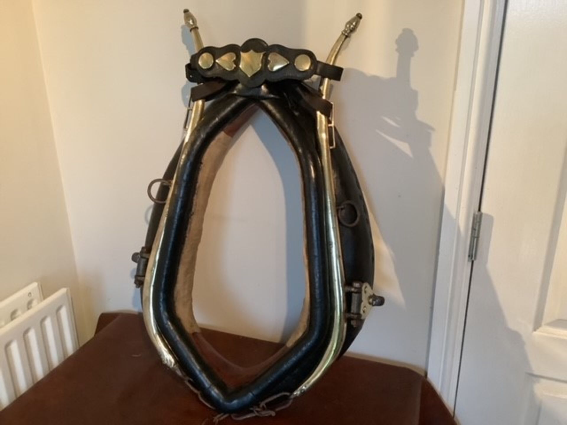 Heavy horse collar with brass hames and hame plate