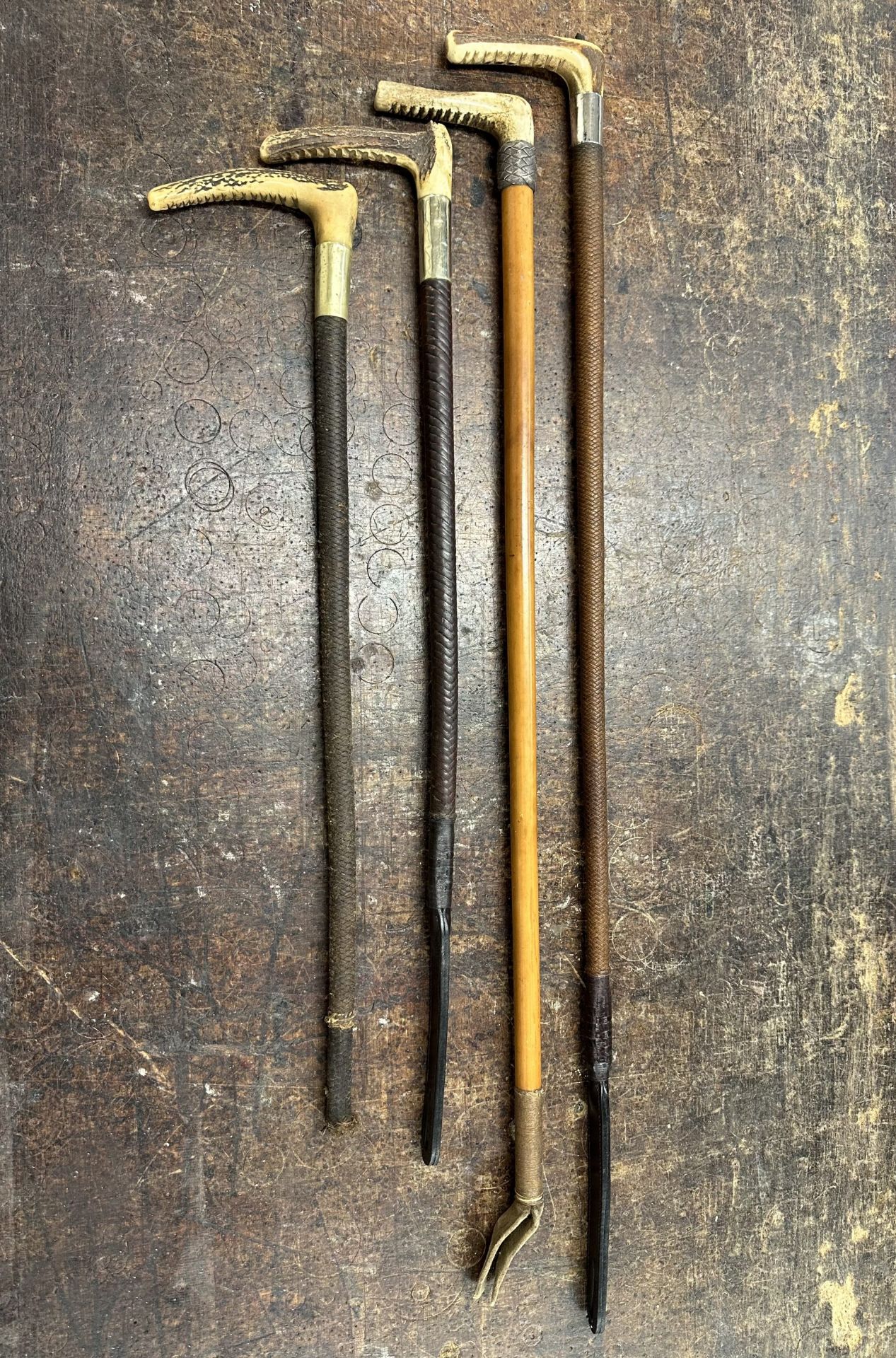 Four hunting whips, new ends and engraved collar