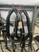 Set of PAIR black and white metal harness with 23-inch collars. This lot carries VAT.