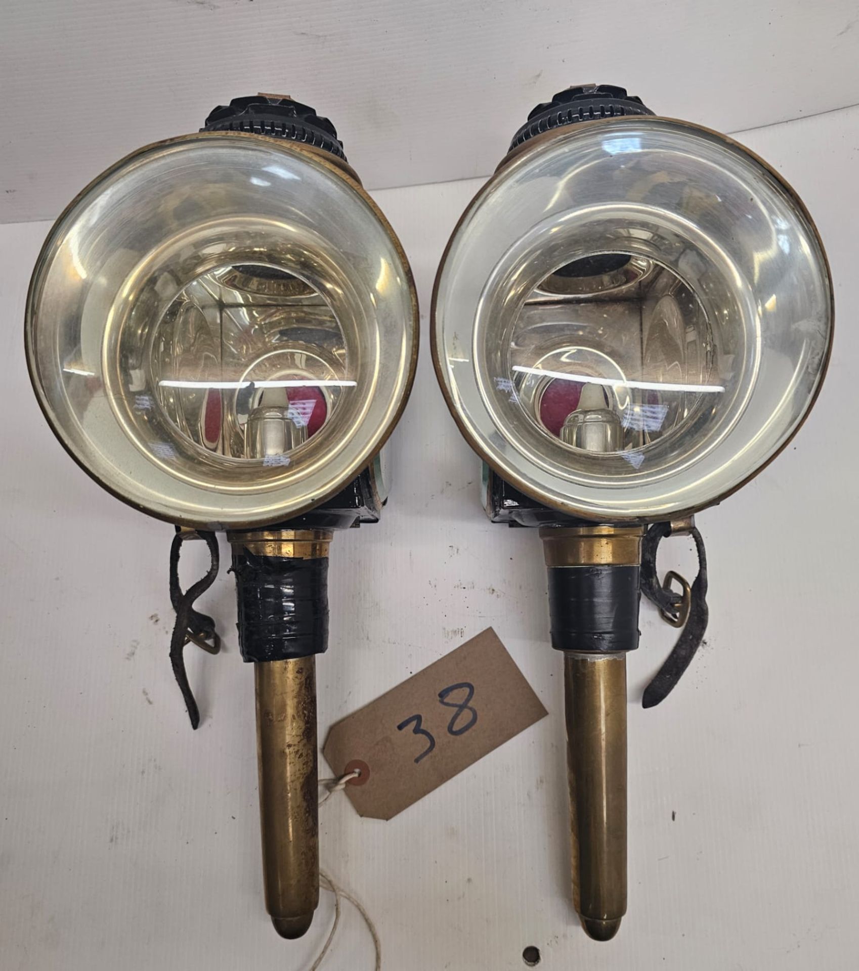 Pair of brass round fronted lamps