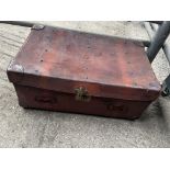 Large brown leather trunk