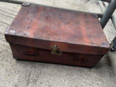 Large brown leather trunk