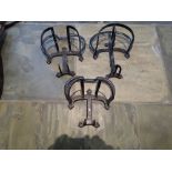 Three vintage iron harness racks