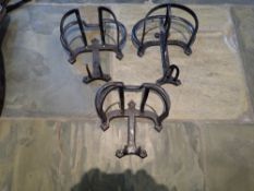 Three vintage iron harness racks