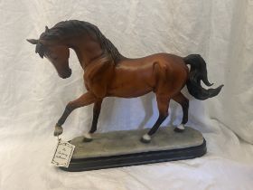 A fine handcrafted model of a bay horse from The Academy Collection