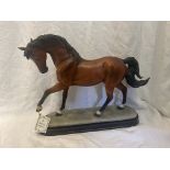 A fine handcrafted model of a bay horse from The Academy Collection