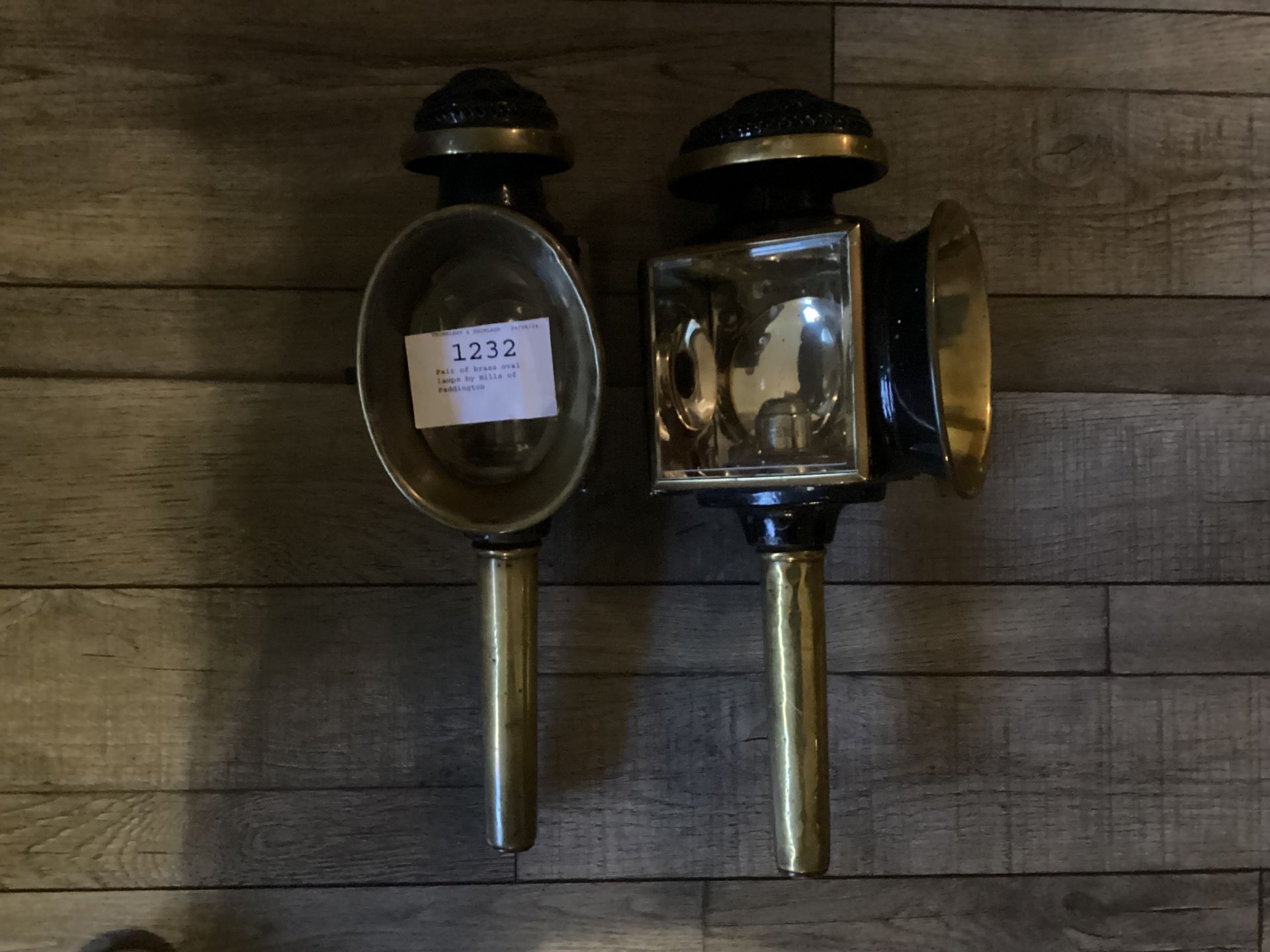 Pair of brass oval lamps by Mills of Paddington