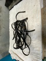Pair of black leather driving reins for a single horse and a brown leather in-hand show leading rein