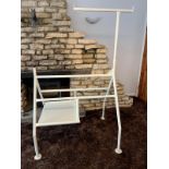Harness horse, powder coated in cream/off white. Steel tubular construction.