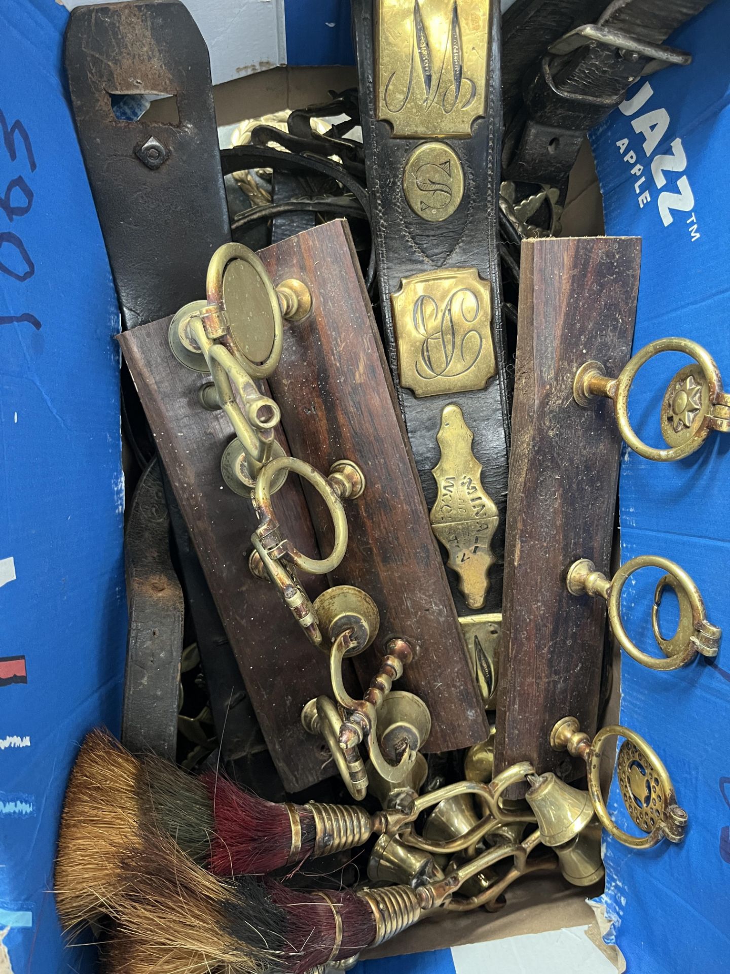 Large quantity of horse brasses on leather lead reins
