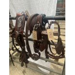 Set of brown and white metal trade harness
