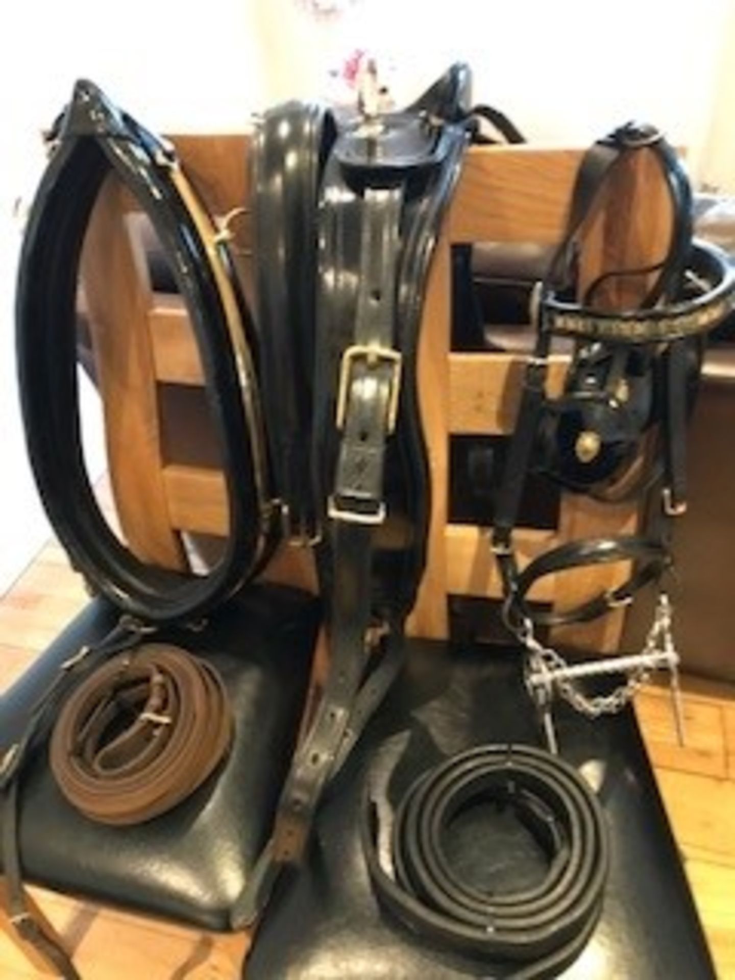Set of Huskissons black patent leather harness with brass fittings.