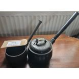 Small Swain cast iron saucepan with lid together with a small cast iron saucepan