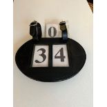 Leather number holder with numbers.