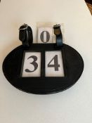 Leather number holder with numbers.