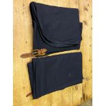 Pair of dark blue Melton cloth aprons, one with an antique leather covered buckle