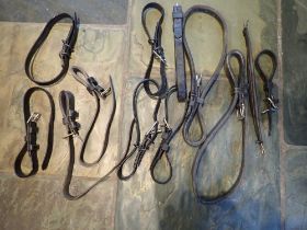 Various breeching straps including leather pair and one soft crupper