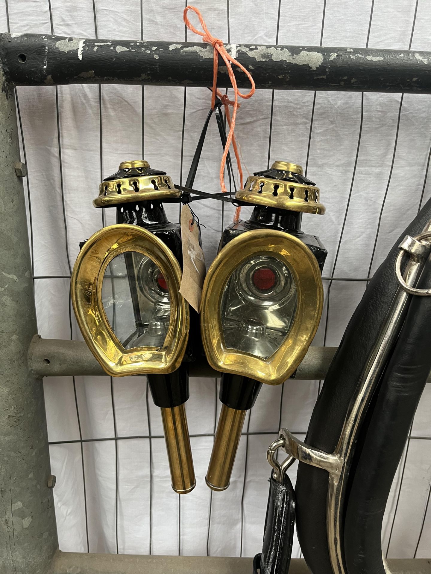 Pair of horseshoe fronted lamps. This lot carries VAT.