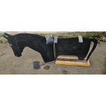 Metal saddle rack in the shape of a horse, with moving parts