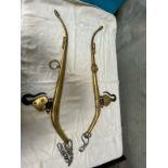 Pair of brass hames with hooks.