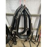 Pair of black collars with white metal hames, 23-inch. This lot carries VAT.