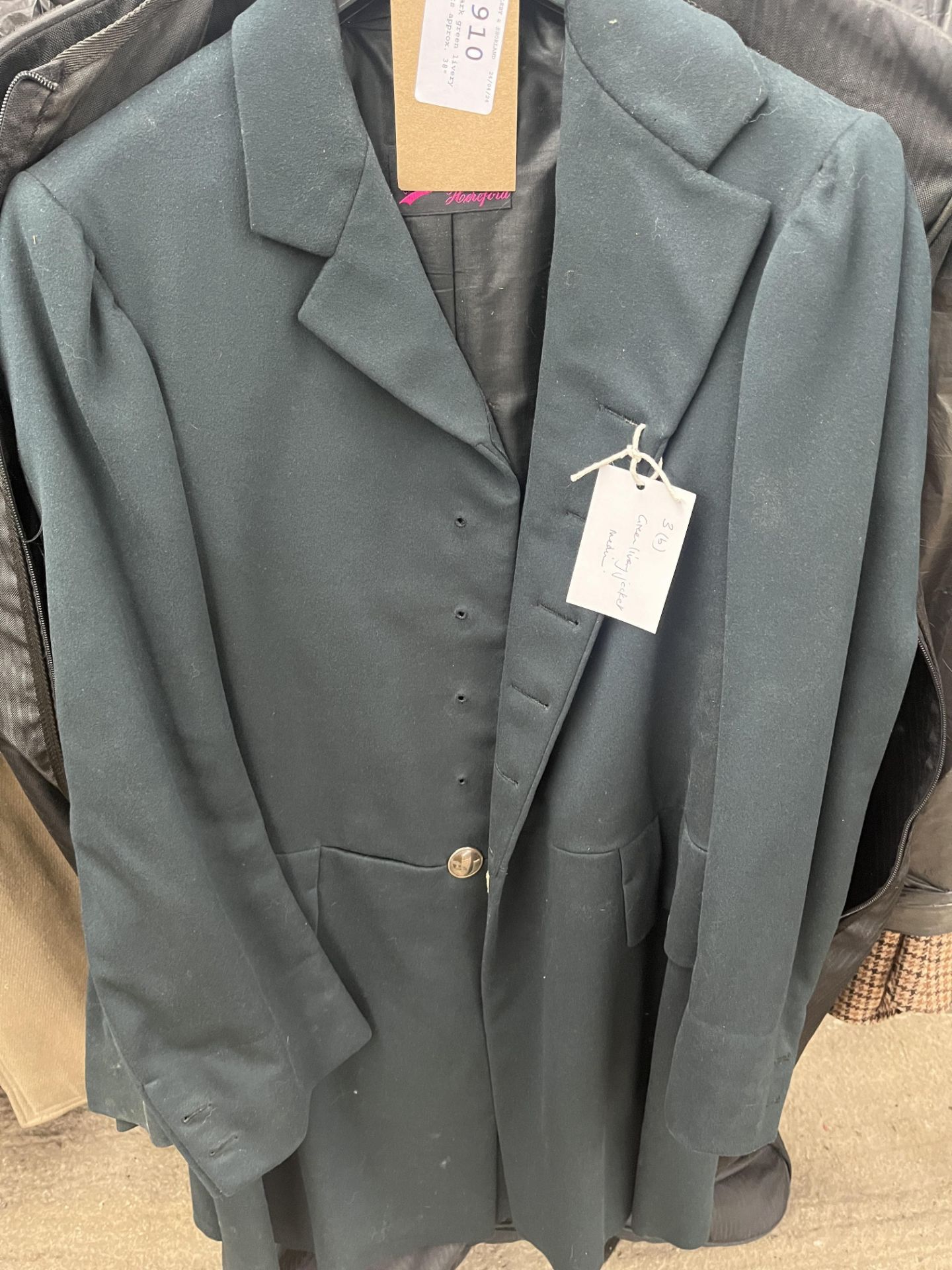 Two dark green livery jackets approx. 38"