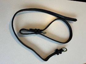 Leather breeching strap with brass buckle, 32" long x 3/4" wide.