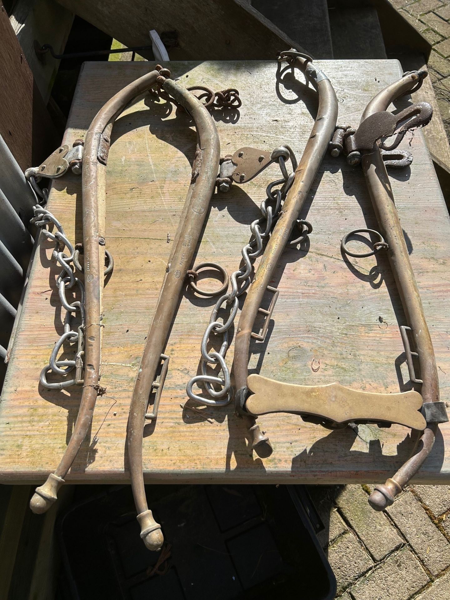 Two sets of solid brass hames