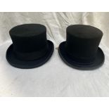 Three black top hats; large and two 7"