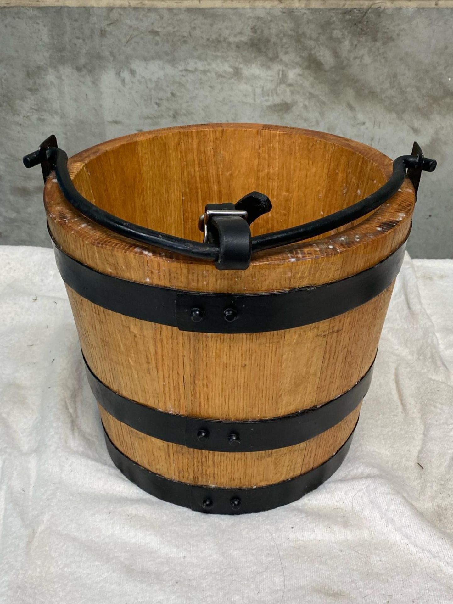 Wood and black metal bucket and hessian nose bag.