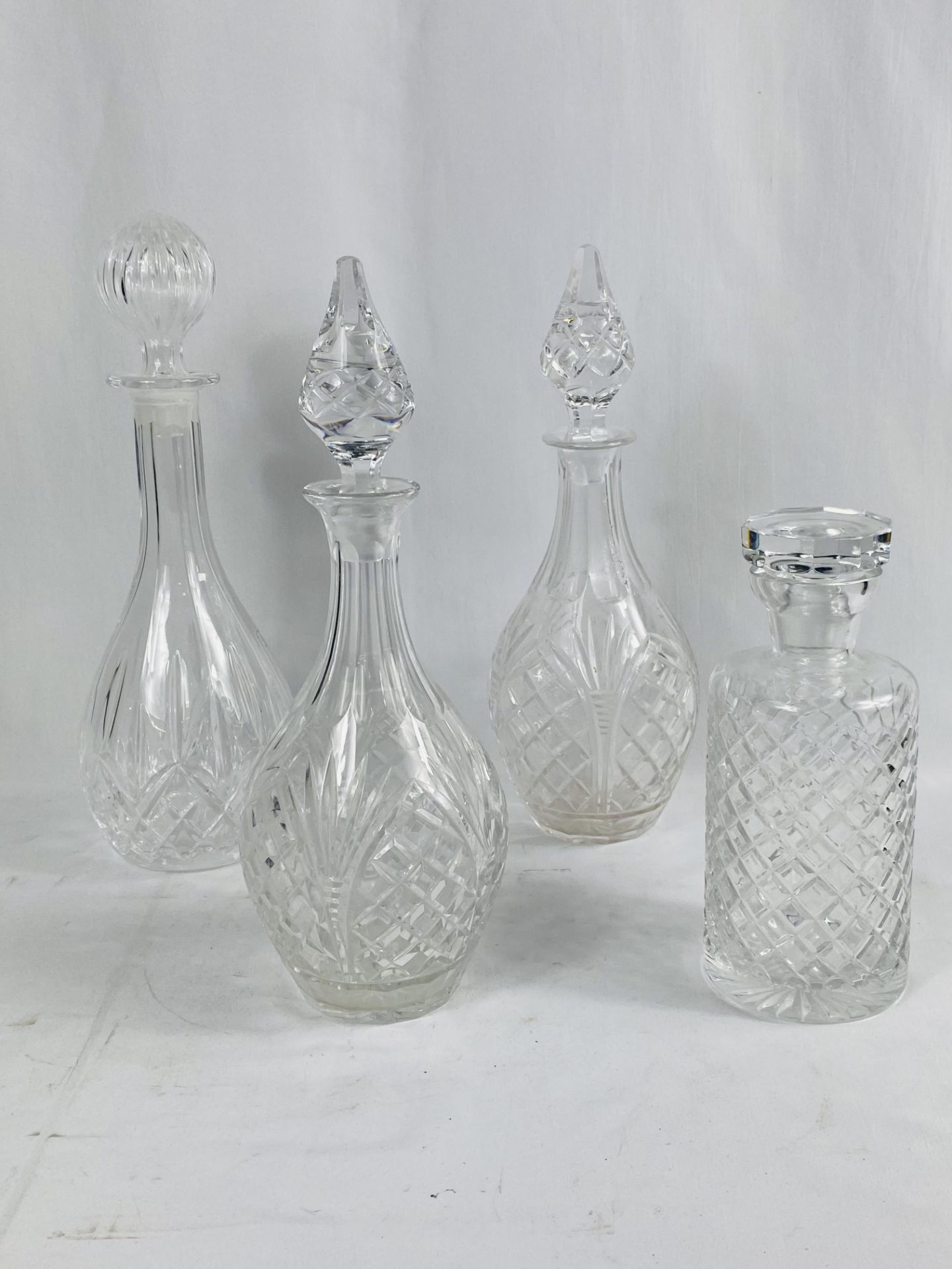 Four cut glass decanters