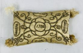 A layette rectangular pin cushion