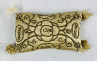 A layette rectangular pin cushion