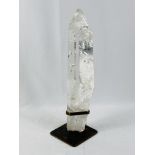 Polished rock crystal mounted in metal base