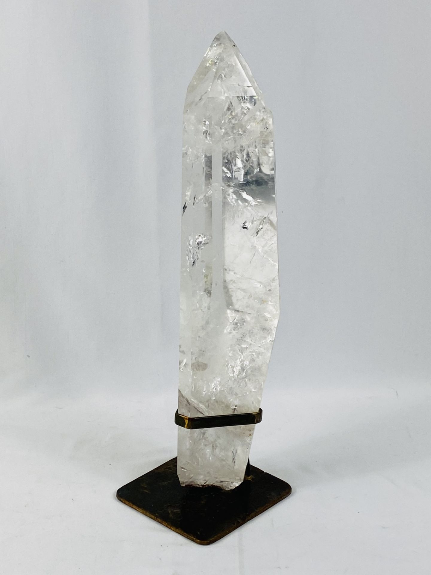 Polished rock crystal mounted in metal base