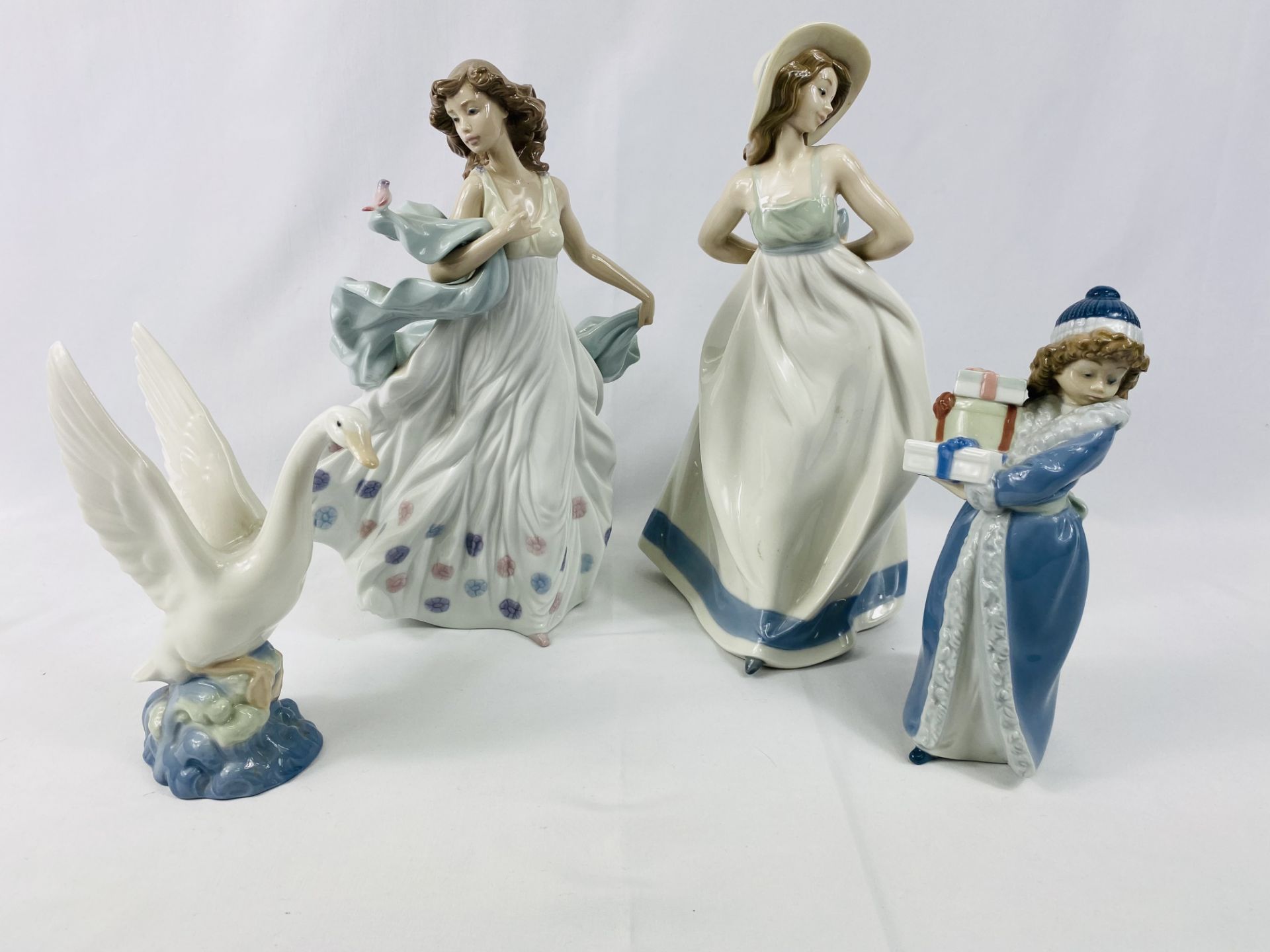 Lladro figurines together with three Nao figurines.