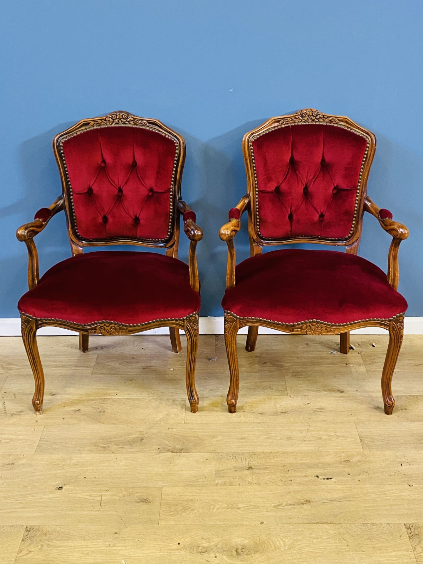 Pair of French style button back elbow chairs