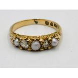 18ct gold ring with three seed pearls and two diamonds